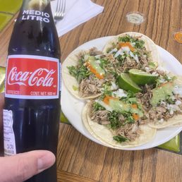 4 Carnitas tacos with a Mexica Coca Cola! 4 Carnitas tacos with a Mexica Coca Cola!
