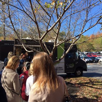 Yayo's O.m.g! - a group of people standing in front of a food truck - Food Trucks Near Me