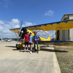 Coastal Biplane Tours - Phil and the front seat crew on a perfect June morning.