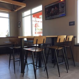 empty tables and chairs in a restaurant