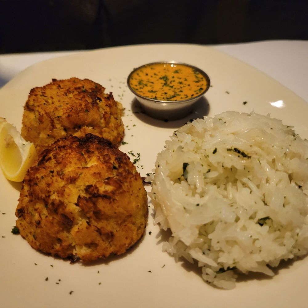 Crab cake dinner with rice and remoulade