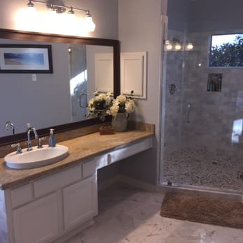 Seek Design & Renovation - a bathroom with a shower and sink - General Contractors Near Me - Houston, Texas Seek Design & Renovation - a bathroom with a shower and sink - General Contractors Near Me - Houston, Texas