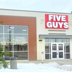 Five Guys - Photograph of the entrance to the Five Guys at 7337 Macleod Trail SE in Calgary, Alberta, Canada.