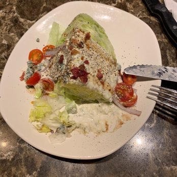 Outback Steakhouse - Blue cheese wedge with a bite missing - Steakhouses Near Me - Inverness, Florida
