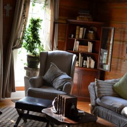 The Farmhouse B&B - the sitting room, with original hand hewn wood beams from the 1800s.