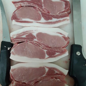 Farmers' Gate Market - cut of pork on a cutting board - Butcher Near Me - Leeds, Maine Farmers' Gate Market - cut of pork on a cutting board - Butcher Near Me - Leeds, Maine