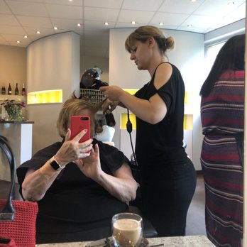 Haar.Werk. - Laura styling my hair. Notice the lovely cappuccino with Cookie. - Hair Salons Near Me - Dusseldorf, NW