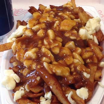 Patate Depot - a plate of fries covered in gravy - Fast Food Near Me - Laval, Quebec Patate Depot - a plate of fries covered in gravy - Fast Food Near Me - Laval, Quebec