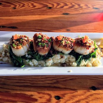 The Lobster Trap - Macadamia and cranberry crusted sea scallops, root vegetable risotto, wilted spinach entree - Seafood Near Me - Bourne, Massachusetts The Lobster Trap - Macadamia and cranberry crusted sea scallops, root vegetable risotto, wilted spinach entree - Seafood Near Me - Bourne, Massachusetts