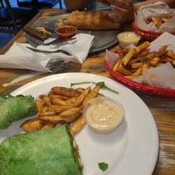 Tu Sei Bella - Crispy chicken spinach  wrap/ Avocado spinach in it with nice hot fries  Stromboli chicken Buffalo flavor delicious
