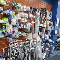 Binson's Medical Equipment and Supplies - Interior display at the Dearborn, MI store showing a large selection of walkers, quad canes, and single-point canes, with a w...