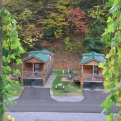 Twin Creek RV Resort - Rental Cabins: 1 bedroom with queen bed, and loft, full bathroom, rocking chairs on porch. No smoking. No pets in cabin.