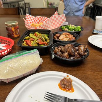 Saap Fusion - a table with plates of food and utensils - Laotian Near Me - Auburn, Washington Saap Fusion - a table with plates of food and utensils - Laotian Near Me - Auburn, Washington