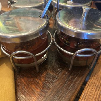 Sisters Thai - We had to get the spice rack to make up for the bland food - Thai Near Me - Fairfax, Virginia