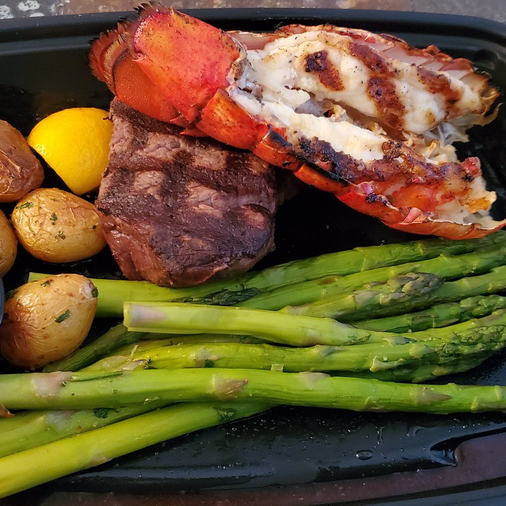 Seasons 52 - Filet Mignon & Lobster with herb butter, asparagus and potatoes. - New American Near Me - Naples, Florida Seasons 52 - Filet Mignon & Lobster with herb butter, asparagus and potatoes. - New American Near Me - Naples, Florida