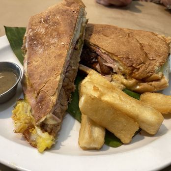 Lazaro's Cuban Cuisine - Classic Cuban Sandwich and Spanish Sausage Sandwich with Yuca Fries and Mojo Sauce - Cuban Near Me - Roswell, Georgia Lazaro's Cuban Cuisine - Classic Cuban Sandwich and Spanish Sausage Sandwich with Yuca Fries and Mojo Sauce - Cuban Near Me - Roswell, Georgia