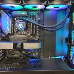 Friend of a Friend Computers - A beautiful custom build. Clean and mostly black, with RGB accents.