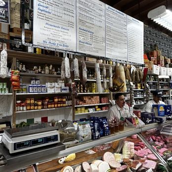 Molinari & Sons Salame Co - a man behind the counter - Meat Shops Near Me - San Francisco, California Molinari & Sons Salame Co - a man behind the counter - Meat Shops Near Me - San Francisco, California