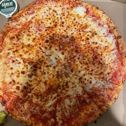 XL New York Pizza with some questionable pizza cutting.