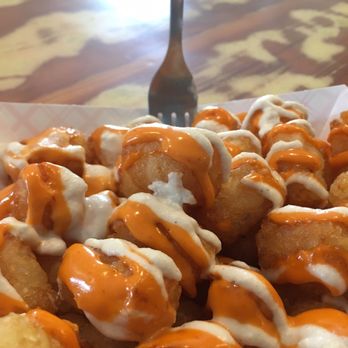 Curia On the Drag - Tater Tots (usually topped with jalapeños, tomatoes, and green onions) - Coffee & Tea Near Me - Gainesville, Florida