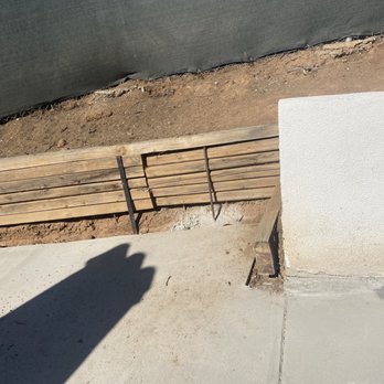 Cement Kings - Prior to work completed; Improperly laid cement and wooden wall holding dirt - Masonry/Concrete Near Me Cement Kings - Prior to work completed; Improperly laid cement and wooden wall holding dirt - Masonry/Concrete Near Me