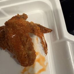 A chicken wing with the hairs sticking out. A chicken wing with the hairs sticking out.