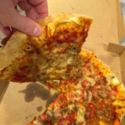 Northern Lights Pizza - Cold pizza upon delivery, notice the solidified cheese and nothing falling off due to it being so cold.