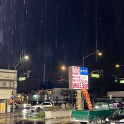 Streets name and another sign in the corner