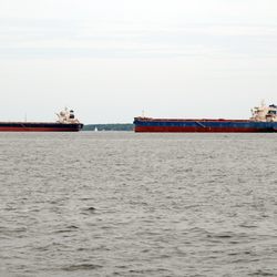 Barges anchored in the Bay awaiting slips in Baltimore Harbor.