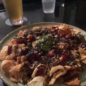The Beach Bar - AMAZING! Wonton chips and perfect amount of ahi. If you like onions I deff recommend asking for extra. TASTYYY - Bars Near Me - Honolulu, Hawaii