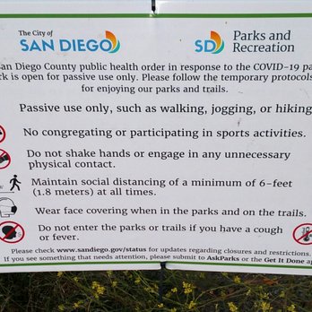 Lopez Canyon - List of COVID-19 precautions mounted on a gate - Hiking Near Me - San Diego, California