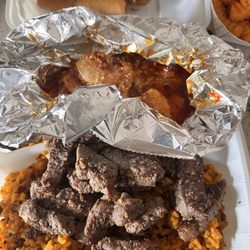 Lacoy’s - New York Steak and Spicy Shrimp, Pastele lumpia and gandule rice.