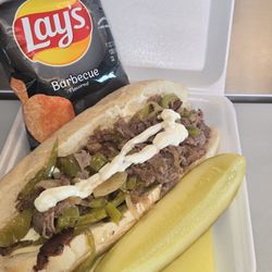Boba Addiction - Philly cheesesteak sandwich comes with chips and a pickle