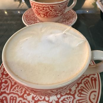 Aaktun Coffee & Bar - Custom created tea latte (black tea, coconut & vanilla syrup, steamed milk and a traditional coffee) - Coffee & Tea Near Me - Durham, North Carolina Aaktun Coffee & Bar - Custom created tea latte (black tea, coconut & vanilla syrup, steamed milk and a traditional coffee) - Coffee & Tea Near Me - Durham, North Carolina