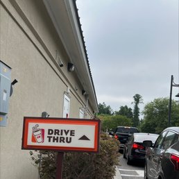 a drive thru sign on the side of a building a drive thru sign on the side of a building