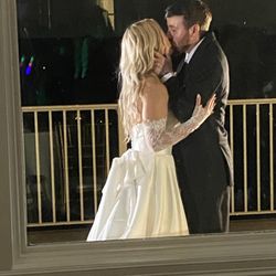 Fun Fun Fun DJs - When our newlyweds snuck outside for quick smooch, they didn't know we were walking by.  What a great pic, right?