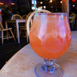 a glass of beer on a table a glass of beer on a table