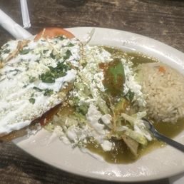 What's left of my Green enchiladas with rice and half of a quesadilla de Rey's. What's left of my Green enchiladas with rice and half of a quesadilla de Rey's.