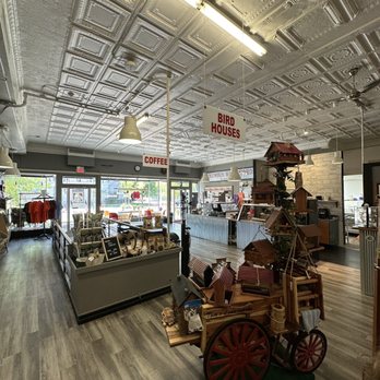 Columbus Washboard - Inside a retail store with signs for bird houses and coffee, displaying various products and a decorative cart with bird houses. - Home Decor Near Me - Logan, Ohio
