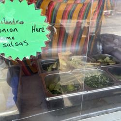 Glenn's Taqueria - Salsa bar with 3 salsas, onions & cilantro, jalapenos, cucumbers, cabbage, and limes
