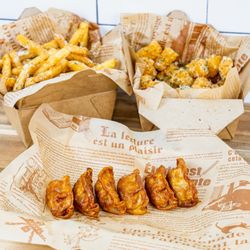 Yas Chicken - Soy Garlic Glazed gyozas, truffle tots, parm fries