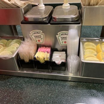 Wingstop - Look how clean this condiment area is, the limes & lemons r perfectly aligned with clear wrap nicely placed between ice & citrus pcs - Chicken Wings Near Me - Costa Mesa, California