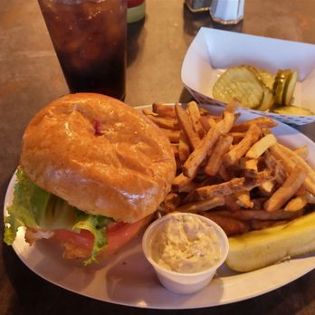 Crafty Rooster - Cod sandwich on a brioche bun with house made fries. - American Near Me - Conway, South Carolina Crafty Rooster - Cod sandwich on a brioche bun with house made fries. - American Near Me - Conway, South Carolina