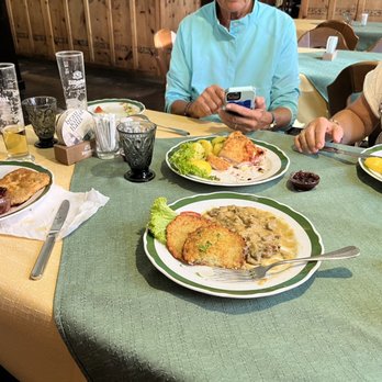 Gasthaus Anich - In front potato pancakes with mushroom gravy. Directly across is the Cordon Bleu. Wiener Schnitzel to the left and right! - Austrian Near Me - Innsbruck, 7