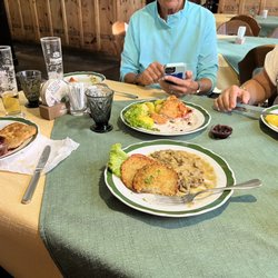 Gasthaus Anich - In front potato pancakes with mushroom gravy. Directly across is the Cordon Bleu. Wiener Schnitzel to the left and right!