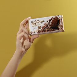 Omniya Delicacy - "Nutella Brownies Dubai Bar: Decadent brownies filled with creamy Nutella and wrapped in smooth chocolate - the ultimate indulgent treat!