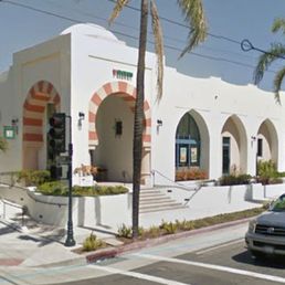 a street view of a white building