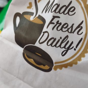 Daily Donuts - a paper bag with a cup of coffee - Donuts Near Me - Tomball, Texas