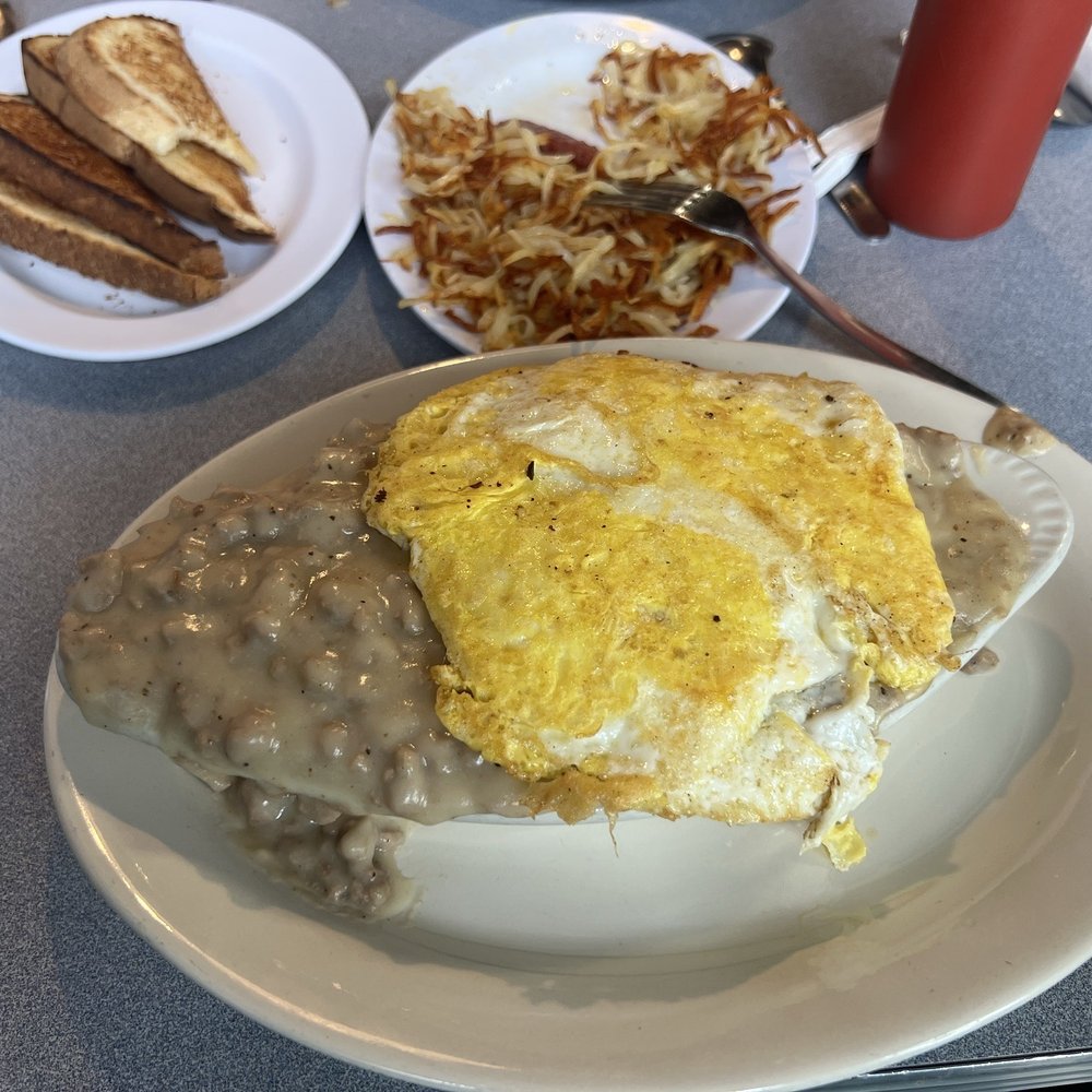 Biscuit and gravy with egg.