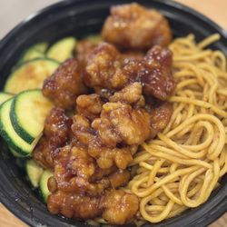 Teriyaki Madness - Orange Chicken Bowl with noodles and zucchini